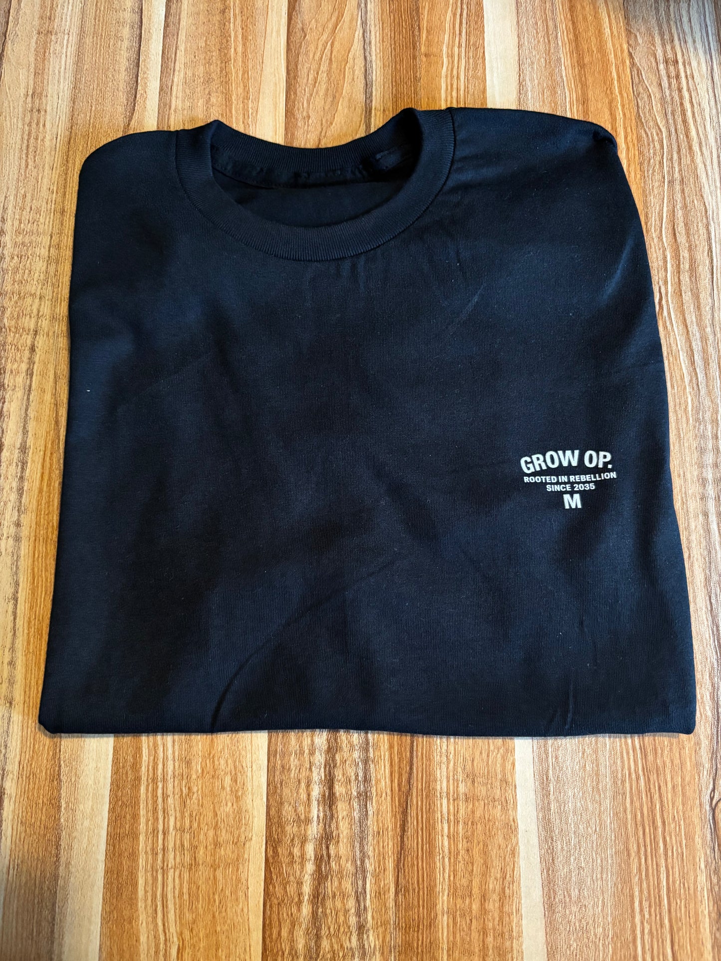 GROW OP. “ROOTED IN REBELLION” ESSENTIAL TEE